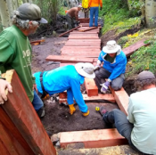 Adopt a Trail in action! A group of volunteers are building a new puncheon to improve trail conditions.